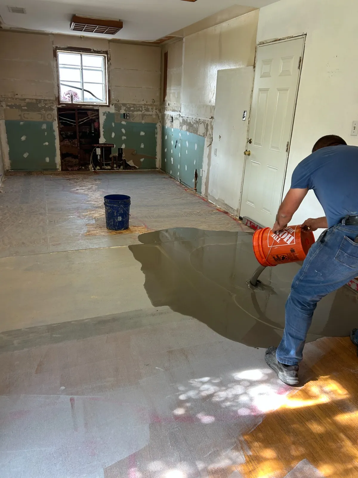 Craftsman working across the wet leveled surface