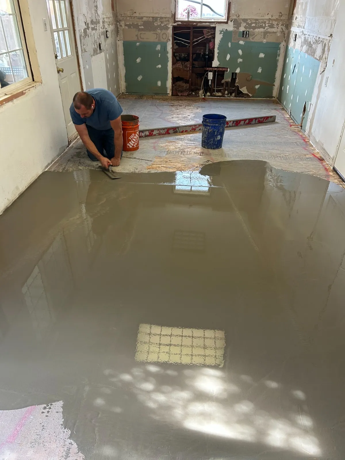 Leveling work in progress in a stripped room