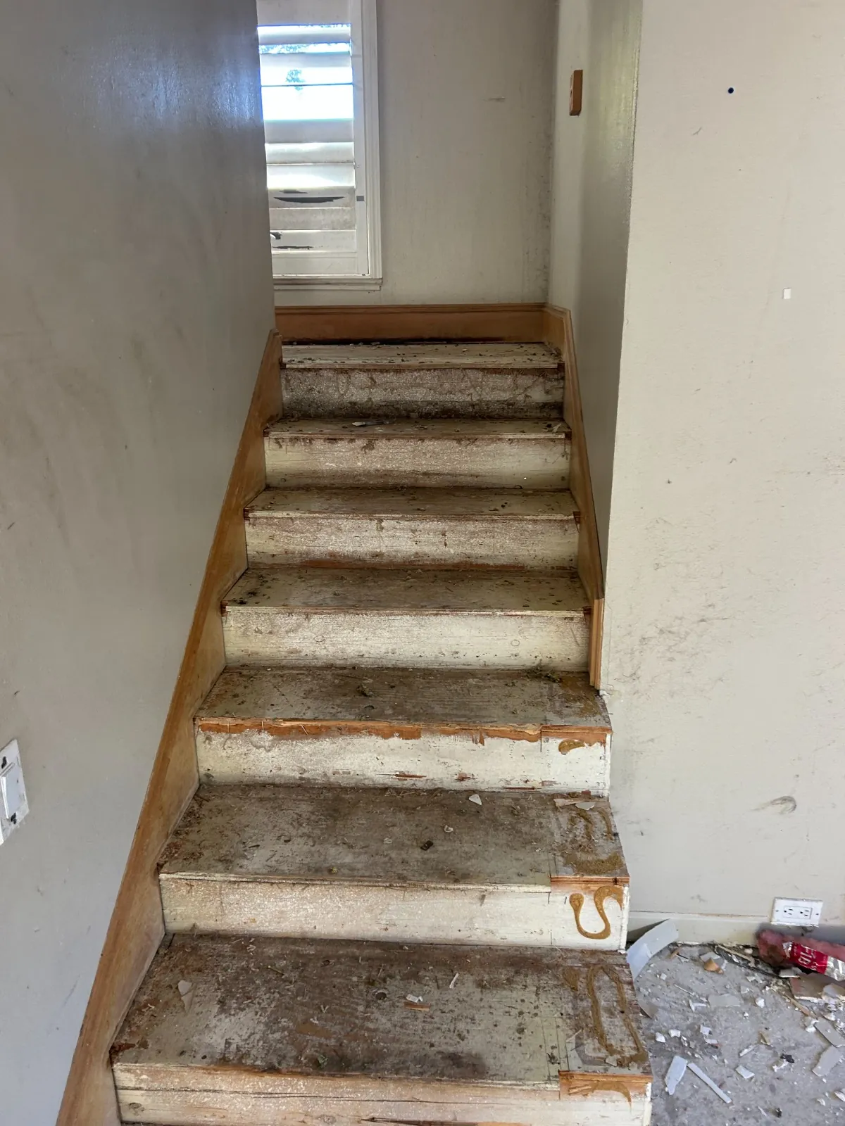 Bare staircase after carpet removal