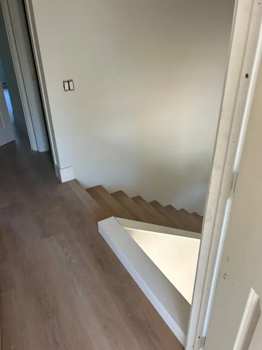 Flooring at the top of the stairs