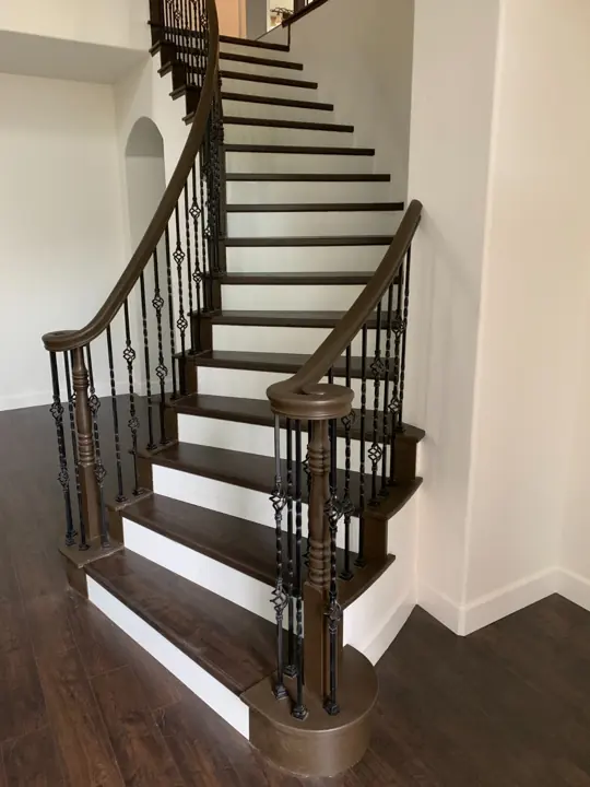 Curved staircase with dark treads